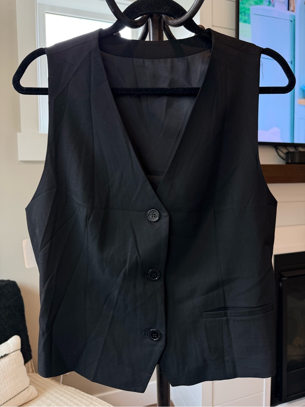 Classic Black Button Front Vest from slit pockets with elastic cinch back